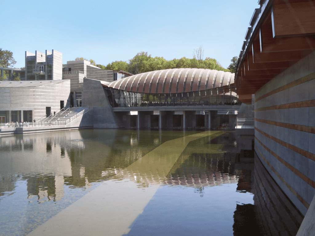 Reflecting pool against modern structure of Crystal Bridges Museum of Art in Bentonville Arkansas
